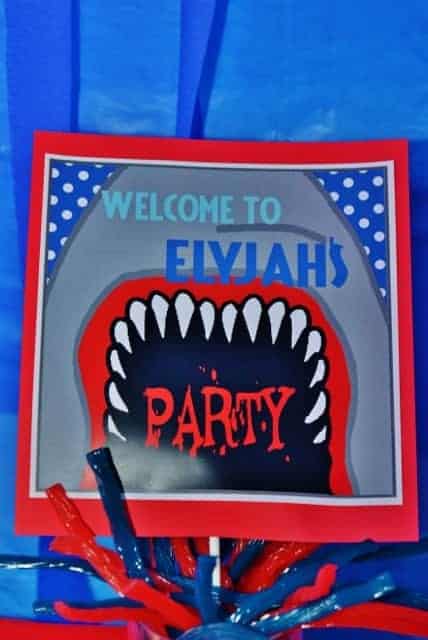 Shark Party: Elyjah's Shark Attack.  Let's take a bite out of this birthday party with a shark party theme!!  Check out this fun shark themed party. #shark #sharkparty #party #partyideas #parties #boy #pool #poolparty #birthday