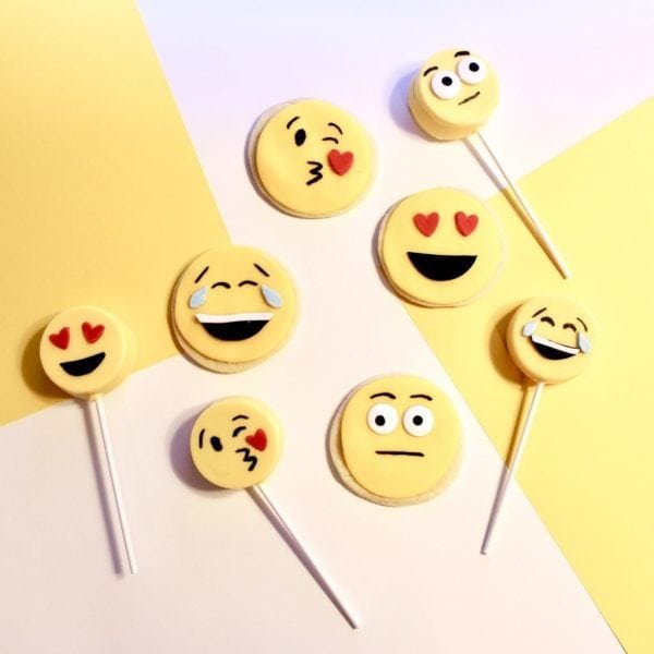 Emoji Birthday Party: DIY Emoji Oreo Pops and DIY Emoji Cookies.  If you are thinking about throwing an emoji birthday party for your little one, we have some easy tutorials for making your own emoji cookies and emoji oreo pops. #parties #holiday #kidbirthday #birthdays #diyandcrafts #baking #emoji #birthdayparty #emojiparty #emojis